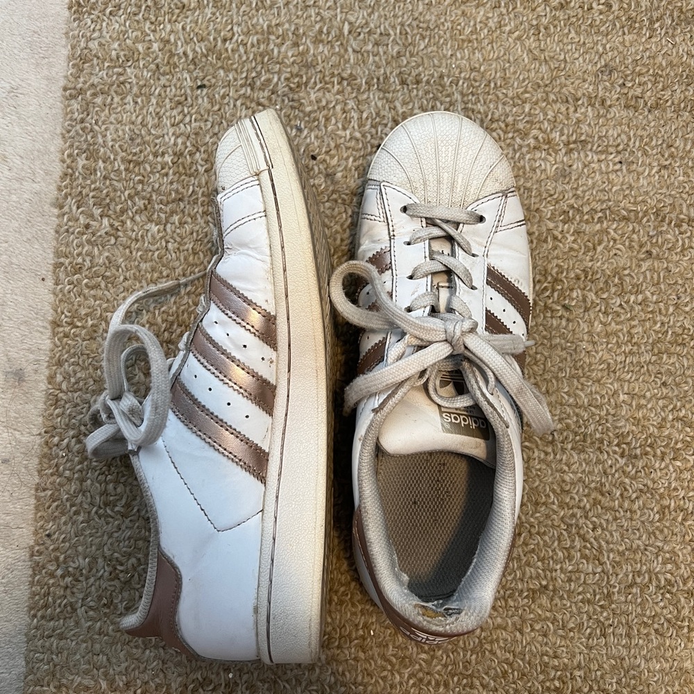 Gold and white adidas superstars Women size 7 - well worn